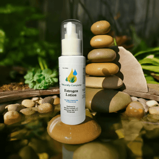 Estrogen cream bottle for menopause relief, soy-free, non-GMO, plant-based, natural formulation, outdoors with stones and greenery.