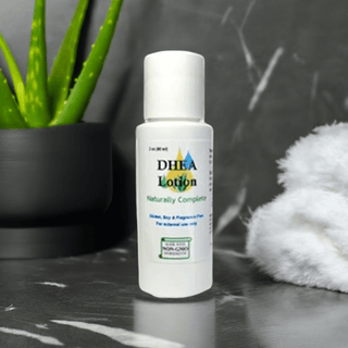 DHEA Transdermal Cream Bottle with Aloe, Non-GMO and Soy-Free, for Men and Women, shown on marble surface with towel.