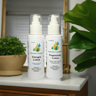 Estrogen and Progesterone Lotion Bottles for Menopause Relief, Soy-Free Non-GMO, Plant-Based, Bioidentical, On a Bathroom Counter.