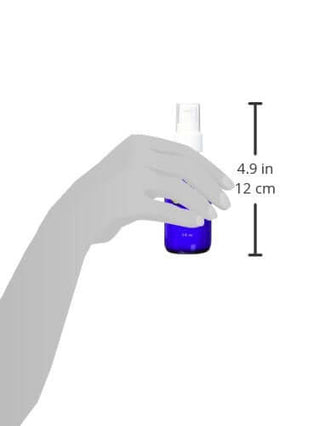 Hand holding Vitamin C Caffeine Daytime Serum bottle, 4.9 inches tall, for skincare.