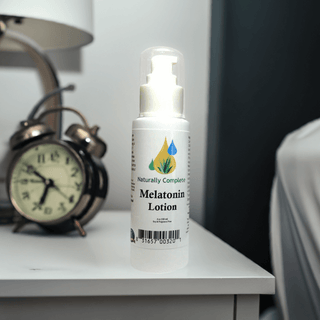 Melatonin lotion pump bottle on nightstand promoting sleep and anti-aging benefits, non-GMO, unscented, made in the USA.