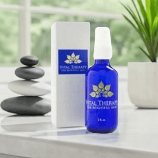 "Vital Therapy anti-aging skin serum bottle and packaging on a modern bathroom counter"