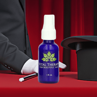 "Vital Therapy skincare bottle on red table with magician hat and wand"