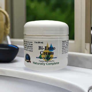 Bi-Estro Cream jar on bathroom counter, 80/20 Estriol and Estradiol blend, Soy-Free, Non-GMO, plant-based estrogen supplement.