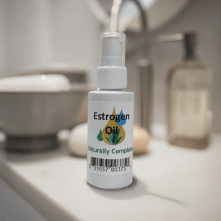 Estrogen Oil 2 oz bottle on bathroom counter, soy-free and non-GMO, aids menopausal symptoms, plant-based product made in the USA.