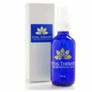 Vital Therapy skincare bottle with packaging, featuring a vibrant blue design for healing and soothing skin treatments.