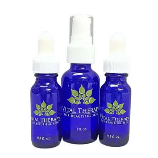 Blue bottles of Vital Therapy peptide lotion for skin transformation and radiance.