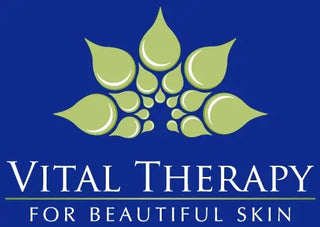 Vital Therapy Skin Care logo featuring green leaf design on blue background.